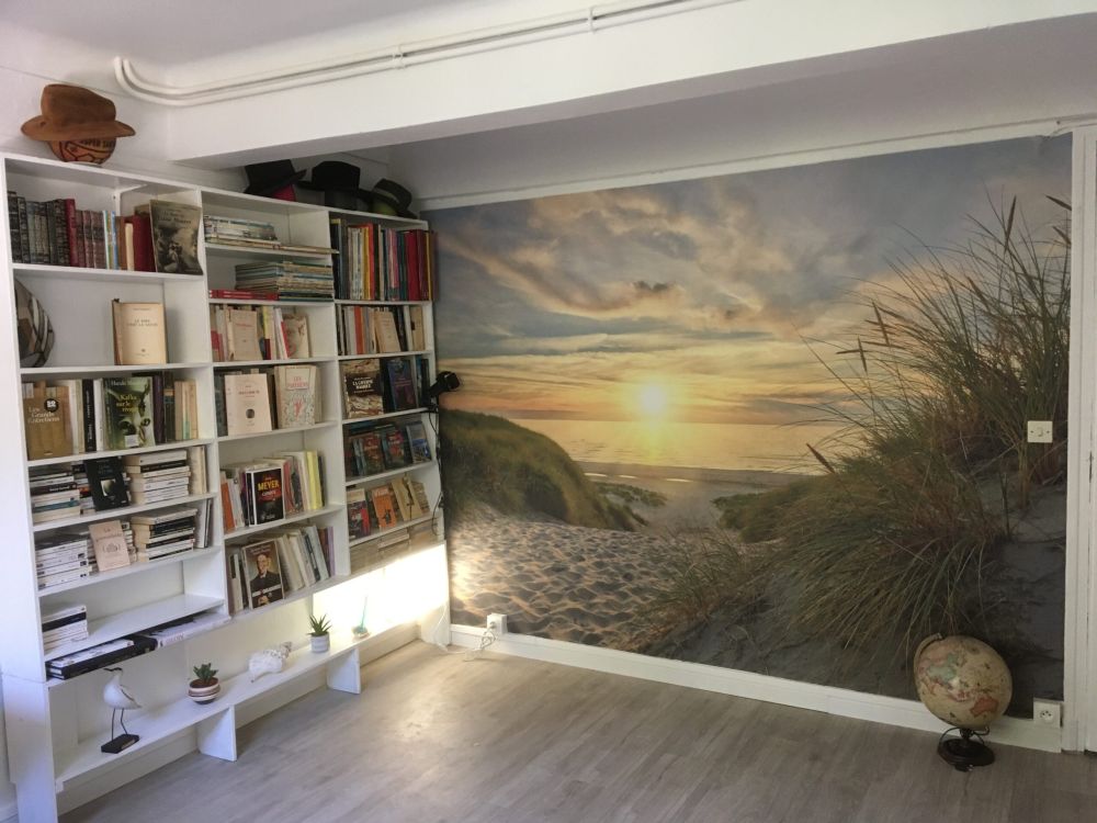 Zonsondergang aan duinstrand