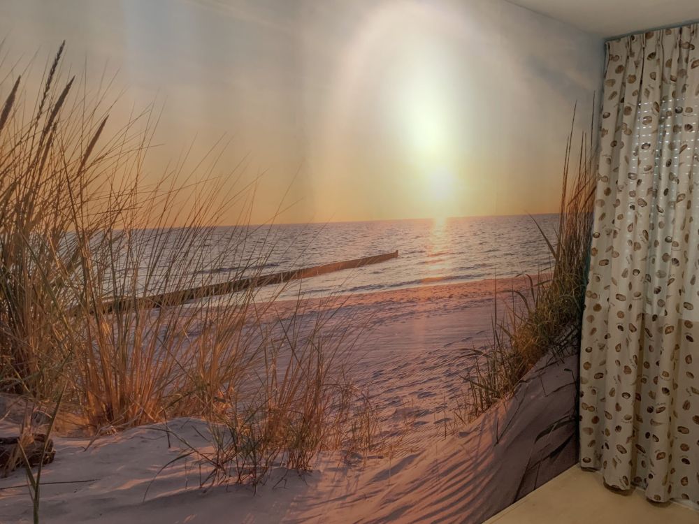Duinstrand met zonsondergang