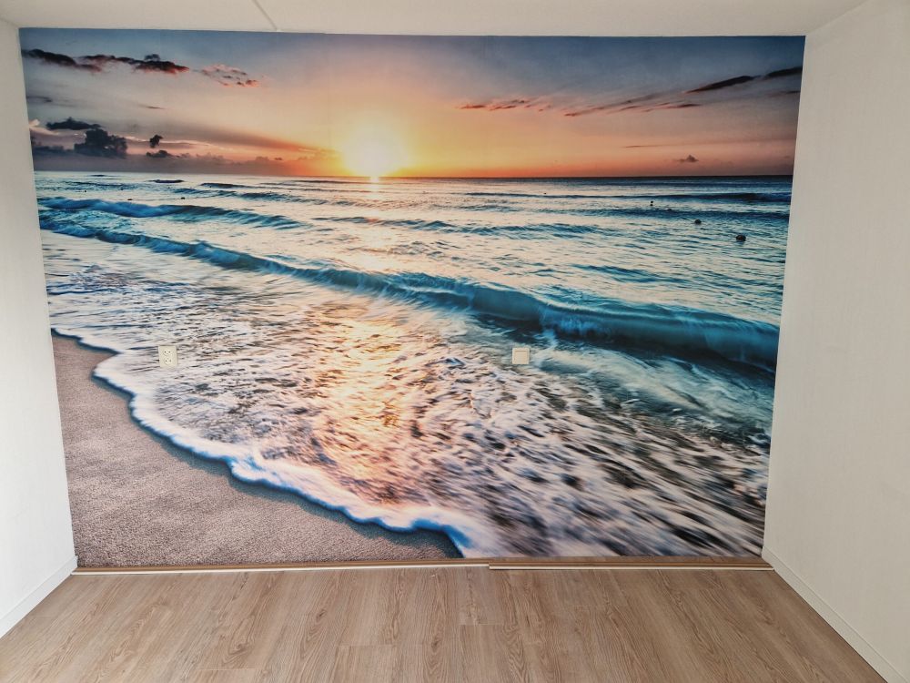 Behang met zonsondergang boven zee