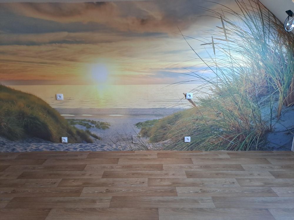 Zonsondergang aan duinstrand