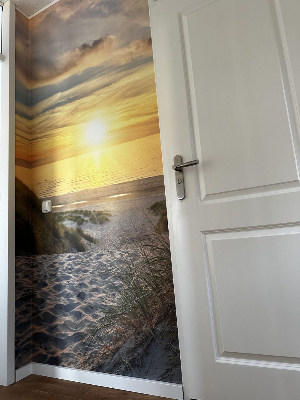 Zonsondergang aan duinstrand