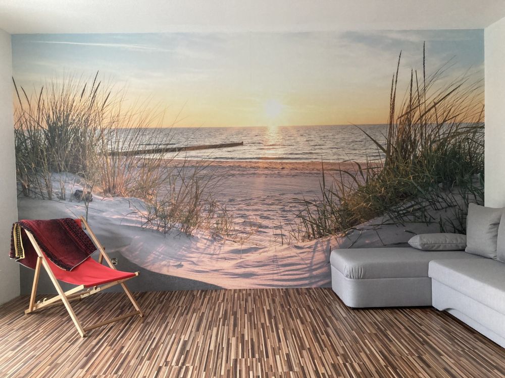 Duinstrand met zonsondergang