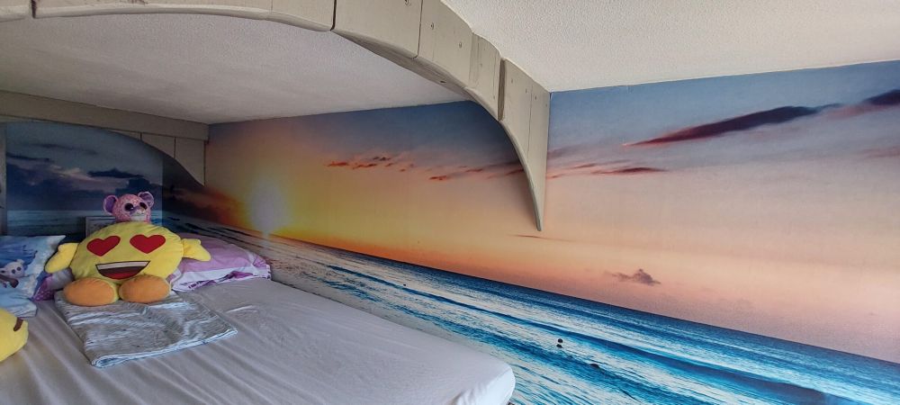 Behang met zonsondergang boven zee