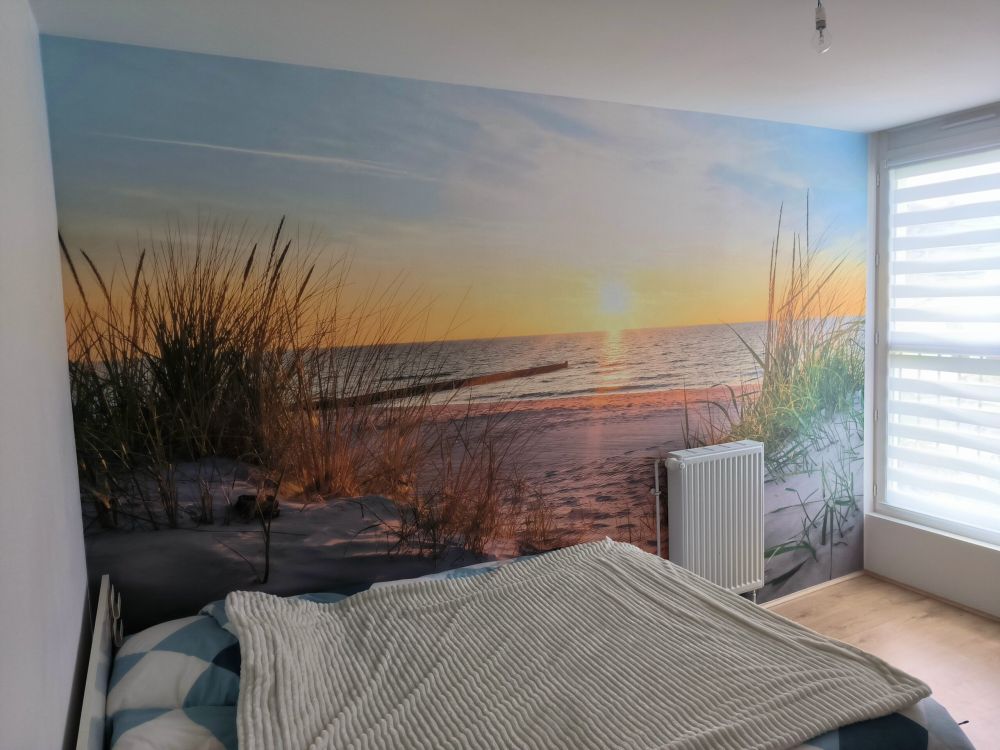 Duinstrand met zonsondergang