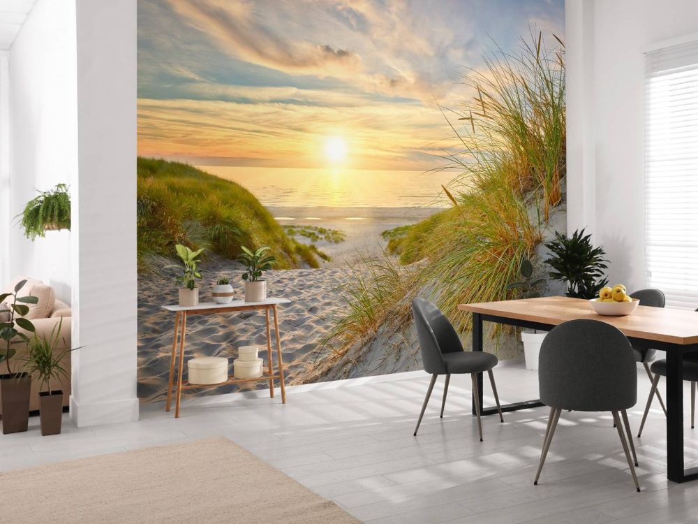 Zonsondergang aan duinstrand