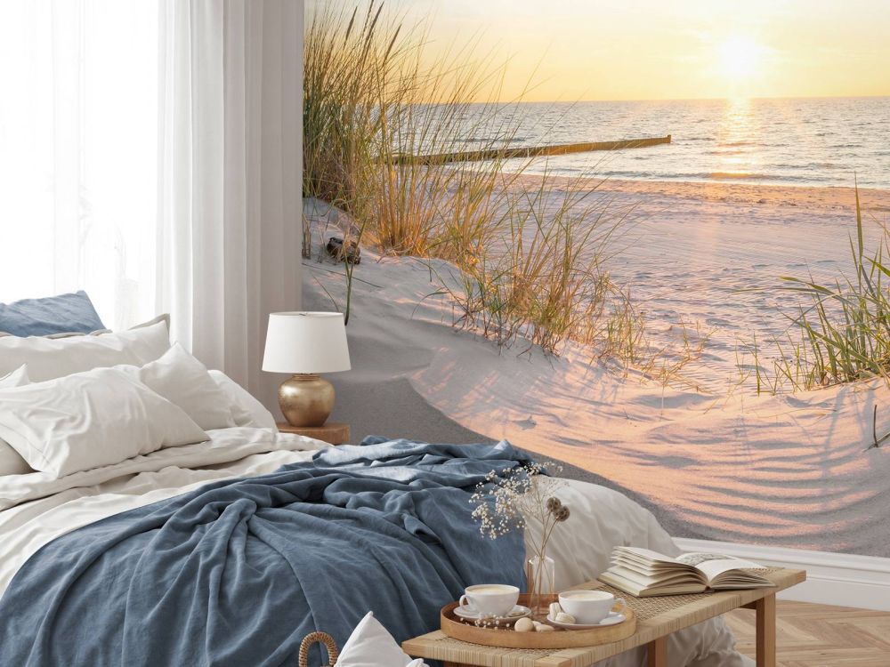 Duinstrand met zonsondergang