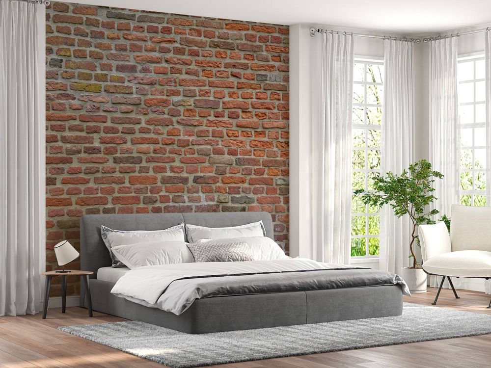 Muur met grote en kleine bakstenen