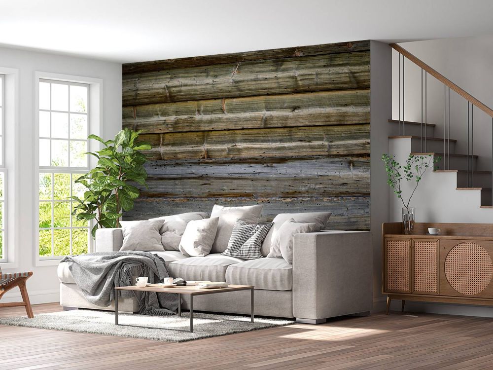 Verweerd hout op stenen muur
