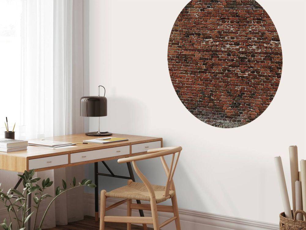 Oude gerestaureerde bakstenen muur