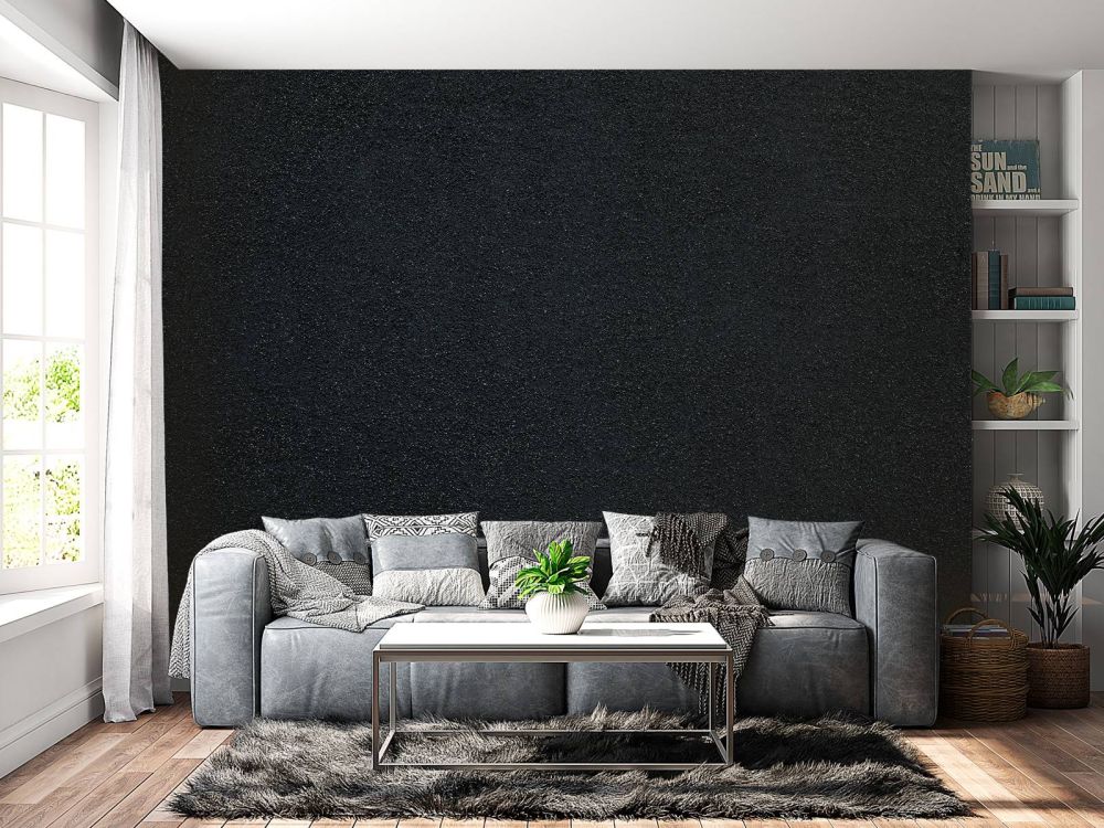 Donkere muur met fijne steentjes