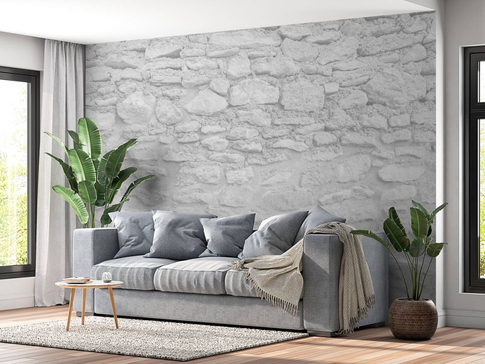 Lichte muur met grove stenen