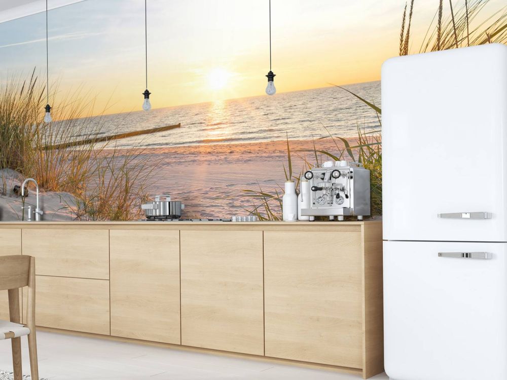 Duinstrand met zonsondergang