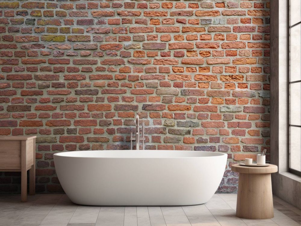 Muur met grote en kleine bakstenen