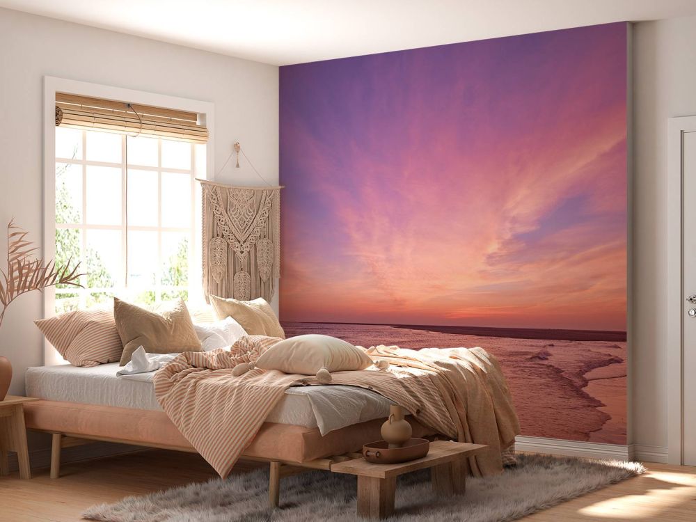 Strand met roze zonsondergang