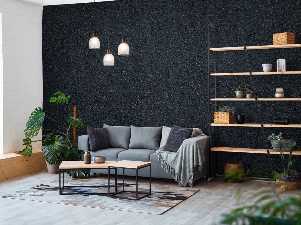 Donkere muur met fijne steentjes
