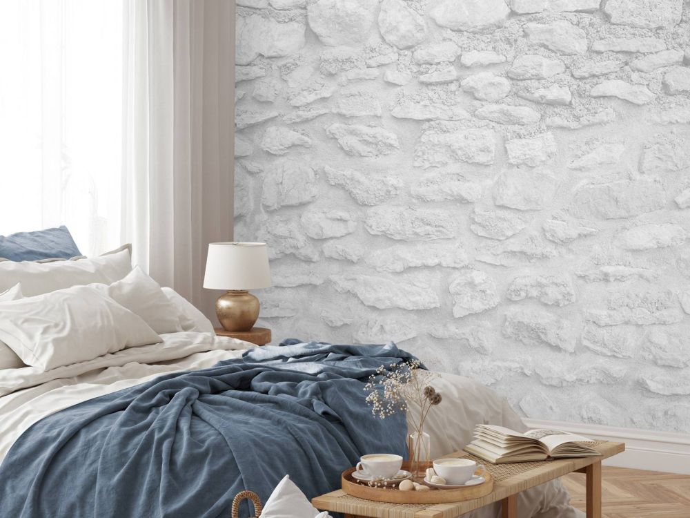 Lichte muur met grove stenen