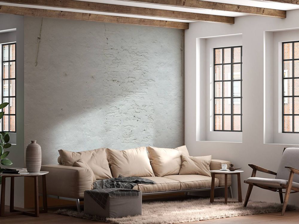 Muur met wit stucwerk en muurankers