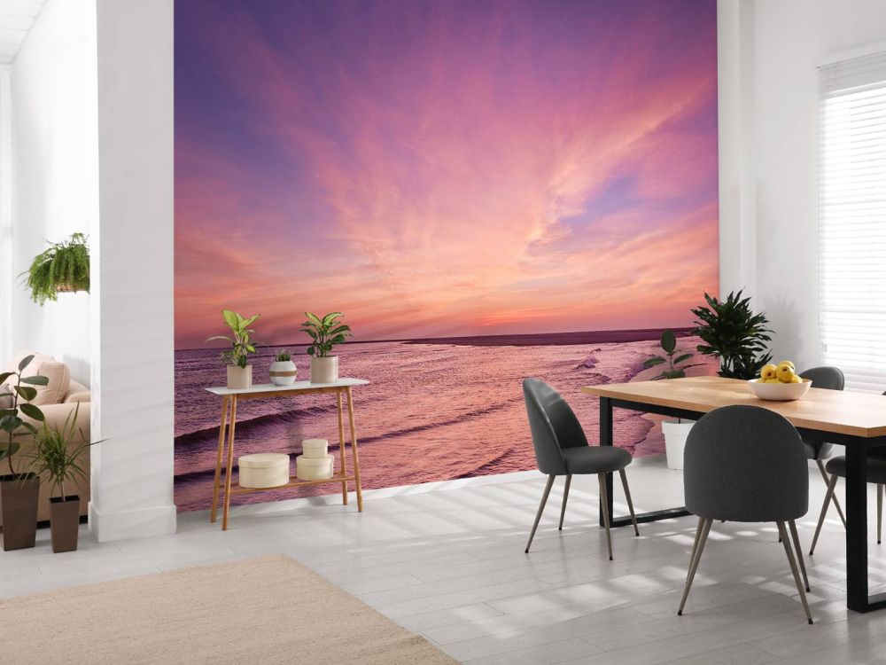 Strand met roze zonsondergang